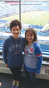 Breast cancer survivors Lorianne Avino (left), a stroke neurologist with practices in Orchard Park and Williamsville, and her friend Karie Kilner, a teacher who lives in Rochester. They developed a strong friendship because of the disease and a new annual tradition: to attend a Buffalo Bills game together.