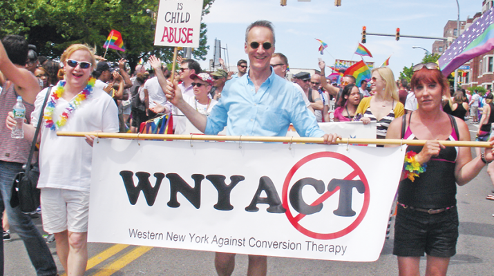 Paul Morgan, founder of Western New Yorkers Against Conversion Therapy (in blue) leading a recent parade against conversion therapy. To the right of him is Lorri Johnson, who is an LGBT activist from Jamestown.