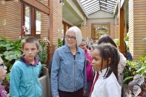 Jeri Mazur giving tours at the The Darwin D. Martin House in Buffalo. She started volunteering there about 12 years ago after working as a school librarian for 25-plus years. “It was invigorating because I had to learn about new things, such as art and architecture,” says Mazur. Photo by Janet Akcakal courtesy of the Martin House Restoration Corporation