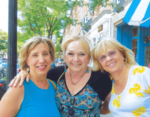 Solo Travelers Club members (from left): Deb Rouviere of Syracuse, Karen Sheldon and Sherry Gillis, both from Rochester, posed for this photo after enjoying a winery tour and delicious lunch in Skaneateles.