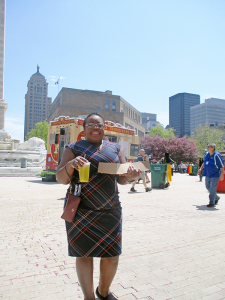 Cavette Chambers enjoys a healthy chicken option from Ted’s Hot Dogs in downtown Buffalo.