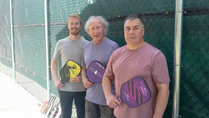 Pickleball can be a family-oriented activity enjoyed by people of all ages. Pictured from left are Kyle Gray, Peter Gray and Kevin Gray.