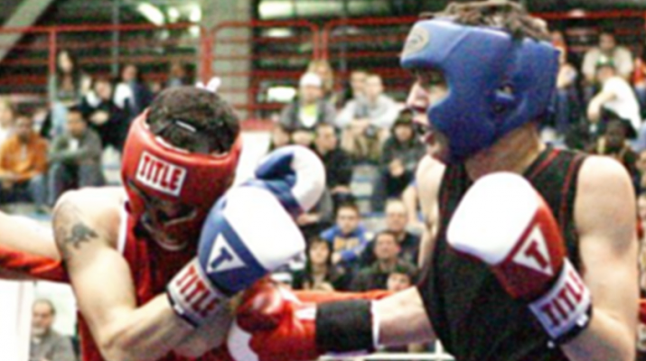 Akhmend Aliyev of Buffalo deliveres a series of body blows to his opponent this recent bout involving Buffalo Golden Gloves.