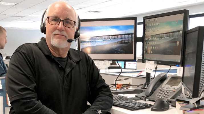 Thomas Stevens, 63, at his sit-stand workstation in Williamsville where he’s experienced the benefits. “It’s a great option to have during the workday. It helps your stress levels and it’s refreshing to stand up and stretch.” 