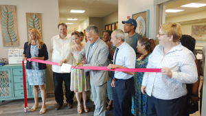 A ribbon cutting event in July to celebrate RSI’s Renewal Center on Elk Street, which is part of its crisis diversion program at Restoration Society, Inc. From left: Nancy Singh, CEO, Restoration Society, Inc.; Joe Woodward, Housing Options Made Easy; Tara Karoleski, Erie County Dept. of Mental Health; Michael Ranney, Erie County Commissioner of Mental Health; Jon Grieco; Maura Kelley, Mental Health Peer Connection.