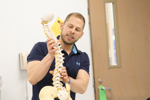 Graig Shapiro, a sports medicine chiropractor in Williamsville: “If you’re in one spot for a long period of time, then basically, you’re doing damage in the long run. The body’s made to move, and you need to be doing that,” he says.