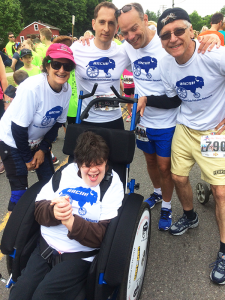 Celebrating a successful race is participant Jess Rubin, her mother Vickie Rubin, and RACIN! volunteers Eric Frank, Frank Cammarata and Kevin Penberthy.