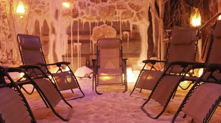 Room at AURA Salt Cave and Wellness, Western New York’s first halotherapy center, opened in 2017. “Our salt cave has about 22,000 pounds of salt brought in from Poland and is made to look like an actual salt cave,” says the owner, Kelly DeBerg.