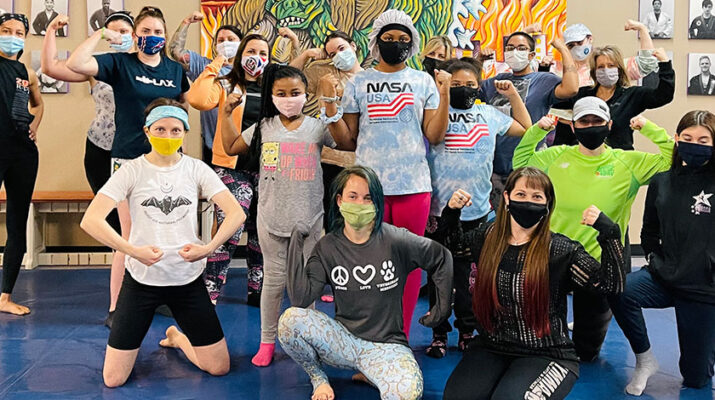 Students from a recently held self-defense class held at WNY Mixed Martial Arts & Fitness in Buffalo pose following an intense session.