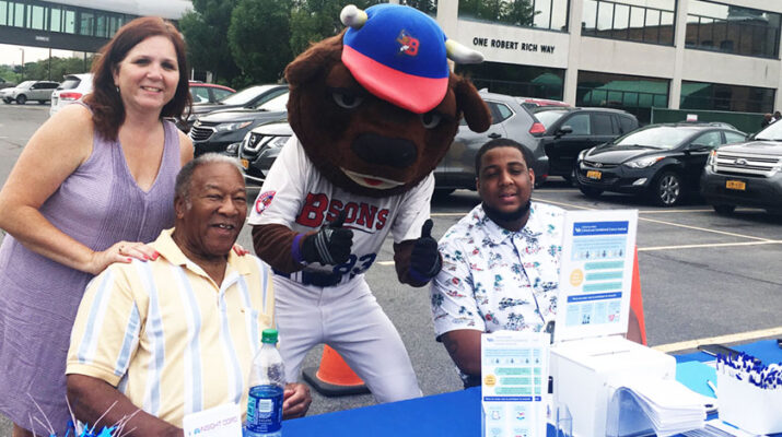 Laurene Tumiel-Berhalter, PVN members Timothy Geiger and Christopher Harper (with Buster Bison) man an information table at a Men’s Wellness Event hosted by Rich’s Products in 2019.